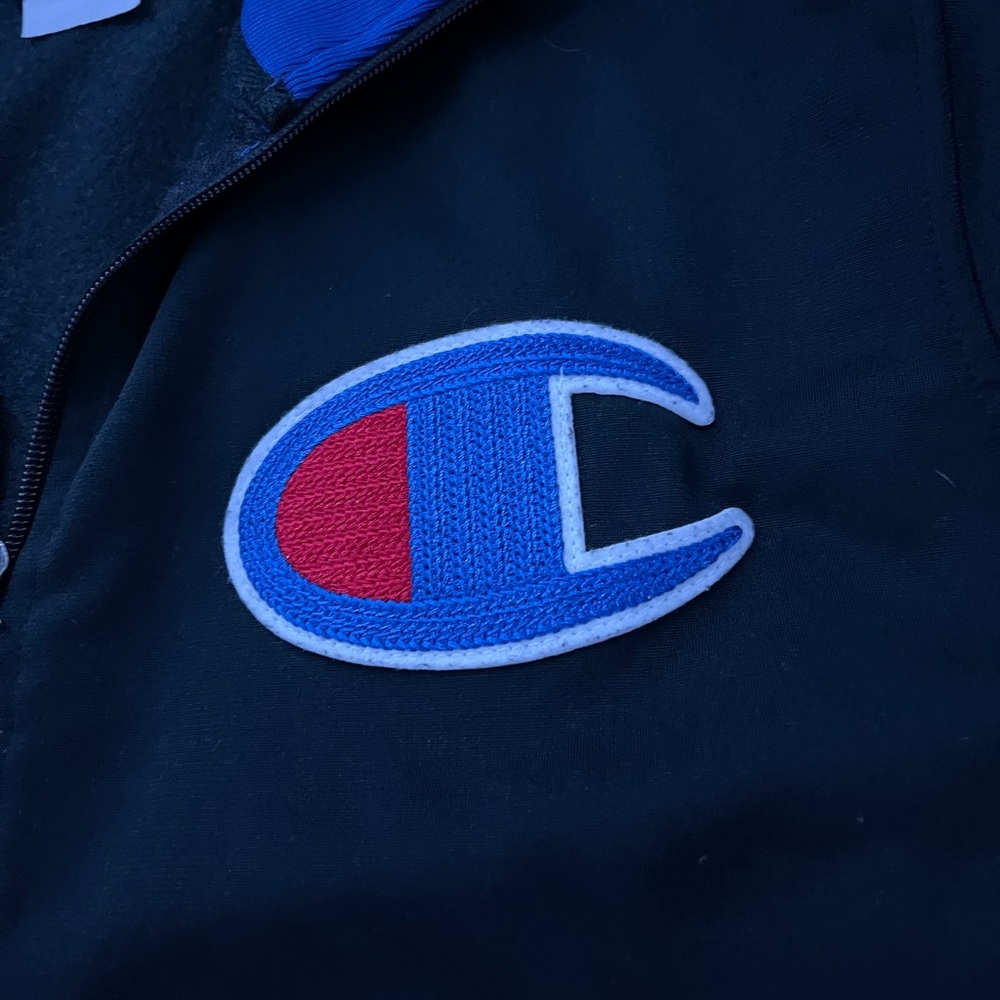 Champion zip up with tapered sleeves.